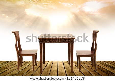 wooden chairs and table on wooden floor