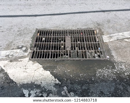 Old drainage grill on the street.