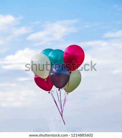 Multicolored balloons, sky background, concept of happy birthday in summer and wedding honeymoon party