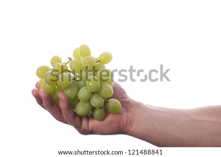 Picture of a fit, muscular arm holding grapes, on a white, isolated background