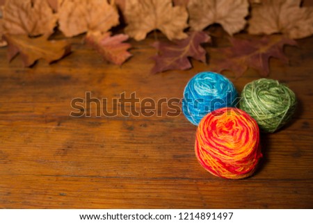 balls of wool on a rustic table