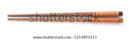 Top view of wooden chopsticks on white background Royalty-Free Stock Photo #1214891611