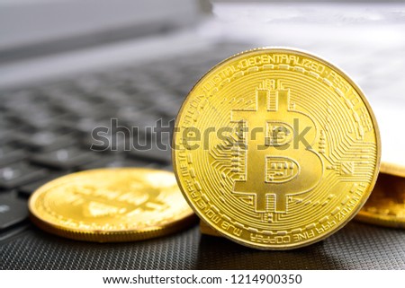 Bitcoin. Crypto currency Gold Bitcoin, BTC, Bit Coin. Macro shot of Bitcoins coins on laptop Blockchain technology, bitcoin mining concept