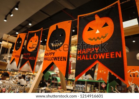 Hanging signs to celebrate Halloween holidays inside the mall.