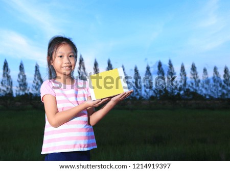 Smiling young girl with holding a empty box