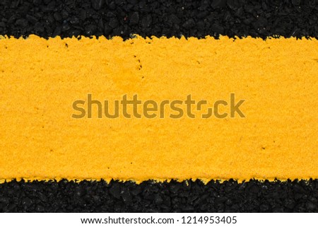 Yellow line on asphalt for textured background