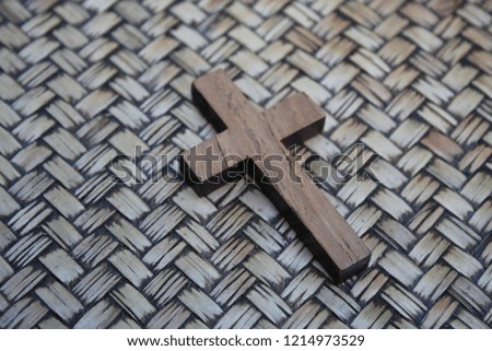 Christian crosses made of wood, on a  brown  patterned surface. background brown tones.