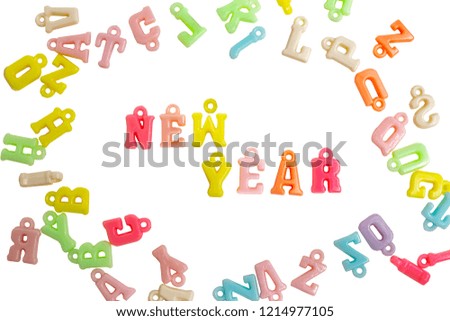 Photo word new year made from plastic letters of the English alphabet on a white background