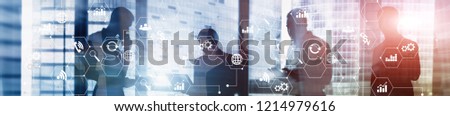 Double exposure mixed media. Diagrams and icons on hologram screen. Business people and modern city on background. Website header banner. Royalty-Free Stock Photo #1214979616