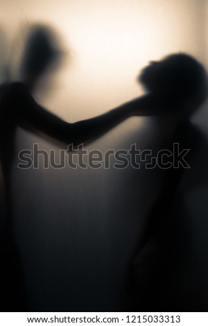 Shadow blur of strangled woman. Violence concept