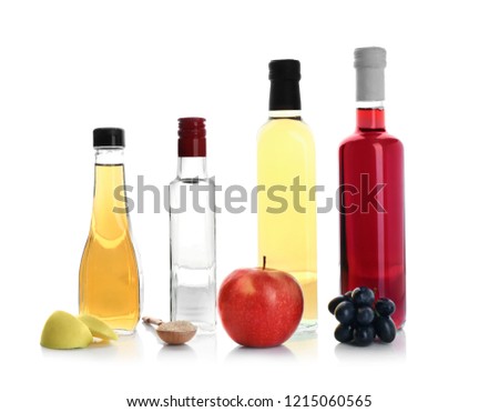 Composition with different kinds of vinegar and ingredients on white background Royalty-Free Stock Photo #1215060565