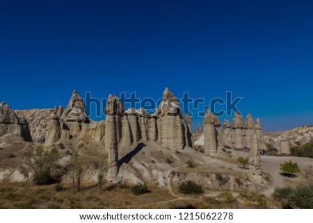 love valley in Turkey, Cappadocia with blue sky and sand hills in background