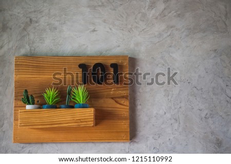 Wooden signboard decoration of room number in the hotel