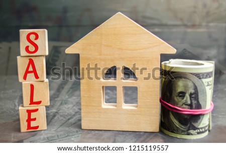 Miniature wooden house and the inscription " Sale ". real estate concept. sell of a home, apartment property sell. Affordable housing apartments