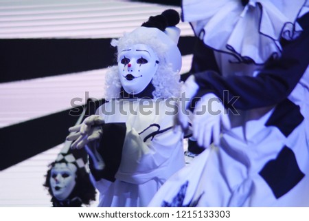 Creepy Scary Mask custome dancer perform on a stage. Creepy Performance for Holloween. Selected Focus 