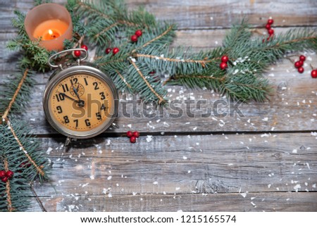 Christmas table place setting with christmas tree branches  and ribbon over wooden table with copy space