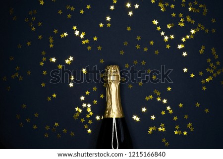 image of champagne bottle on dark blue  background 
