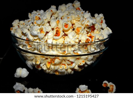 A clear focus of yummy popcorn bowl with dark background
