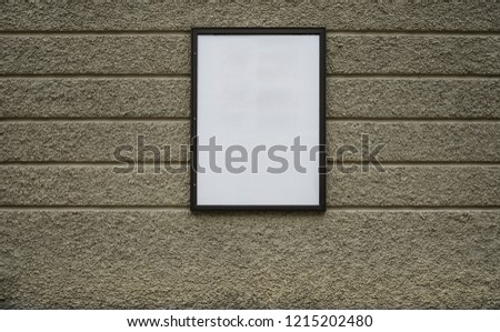 blank wood frame on ancient stone wall background