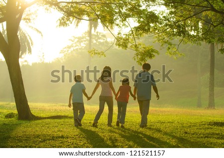  asian family silhouette during beautiful sunrise