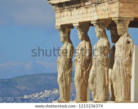 Extreme zoom closeup detail photo of iconic Caryatids statues in porch of Caryatids located on top of Acropolis hill next to iconic masterpiece Parthenon, Athens historic center, Attica, Greece