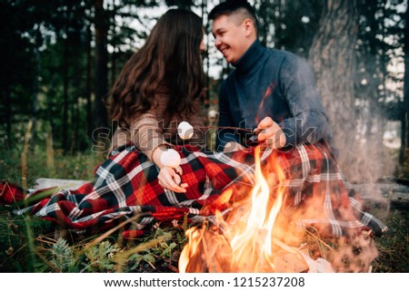 Summer Camp Fire. Couple in love. Camping fire. Love story. Romance lovers. Fashion photo.