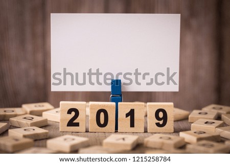 Year 2019 Concept with old wooden background.