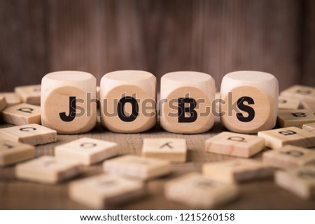 Jobs Concept with old wooden background.