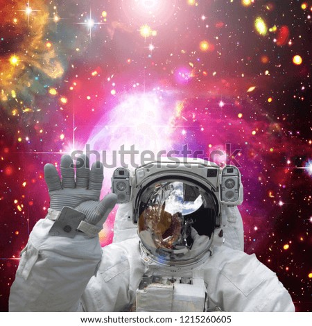Astronaut waves. The elements of this image furnished by NASA.
