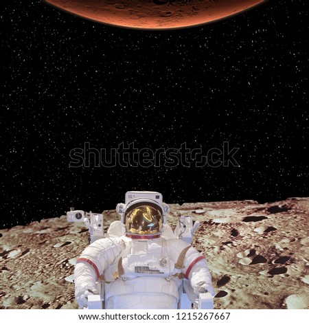 Alien planet landscape. Astronaut. Stars. The elements of this image furnished by NASA.
