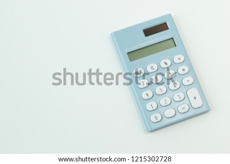 The blue calculator white background  image close up.