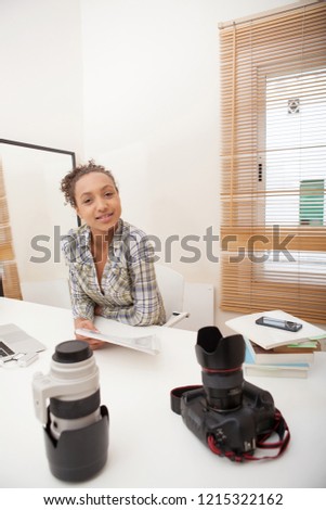 Portrait of african american photography student working, looking smiling home indoors. Teenager learning creative photo with professional equipment, technology lifestyle.