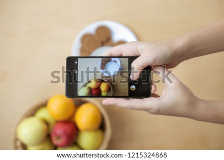 Blogger taking picture of food.