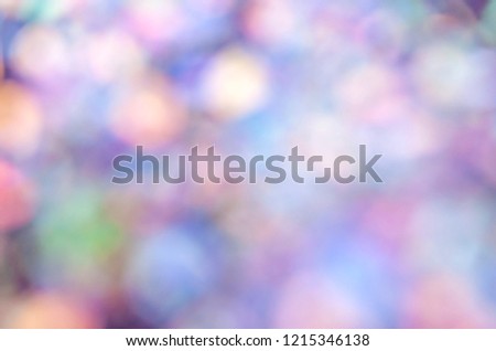 Winter blurry background. bokeh lights in pastel rainbow colors