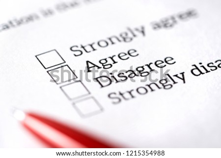 Opinion poll, survey and questionnaire concept. Filling multiple choice question form with paper and pen. Agree or disagree check box. Politics or human resources research, feedback or experience.
