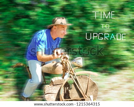 Senior on a wooden motorcycle . Concept of upgrading equipment and changes in life