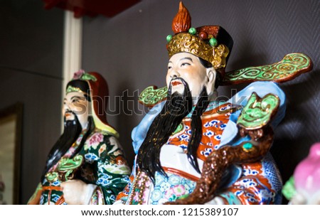 Traditional Chinese sculptures and symbols. An old porcelain statue of Chinese guardian. Chinese God of Fortune or Three gods of the Chinese, Fu Lu Shou. (Hock Lok Siew) means Prosperity and Longevity