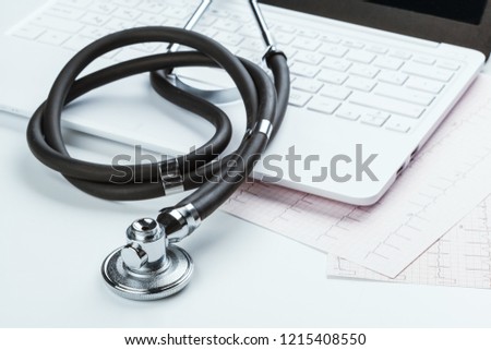 Stethoscope With Laptop on the table