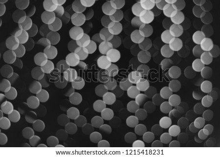 Bokeh lights on black background, pattern of white circle on black