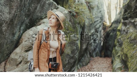 Close up Attractive young woman in stylish hat looking around. Round dolly shot
