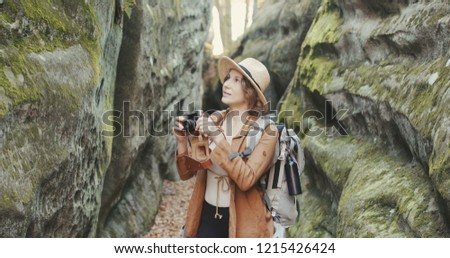 Portrait happy woman taking pictures with vintage camera. travel girl spring. beautiful attractive fun photography. close up tourist vacation