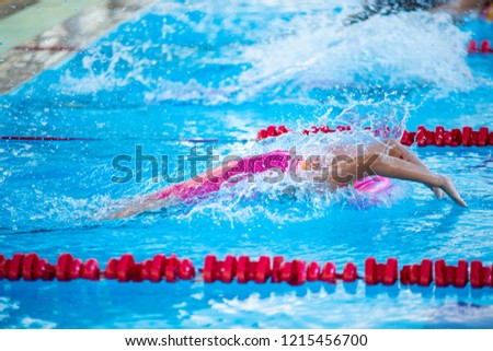 Swimmer athlete starting backstroke competition