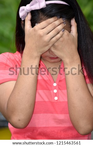 Depressed Youthful Filipina Teenager Girl