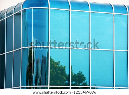 Glass wall of modern building with rounded corners