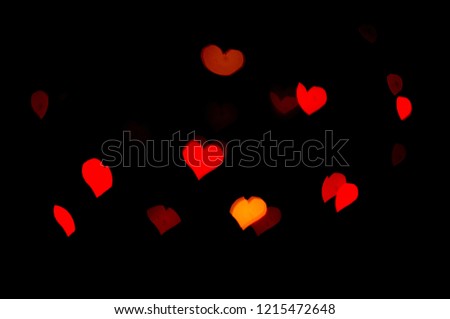 Red lights bokeh.  Abstract background.  Heart-shaped bokeh.  Express love.  Valentine background.