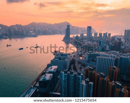 Aerial bird eye view Photography viewpoint Cityscape in Hong Kong with illuminated buildings. Victoria harbour at twilight in Hong Kong