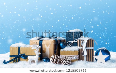 Christmas gift boxes in snow.