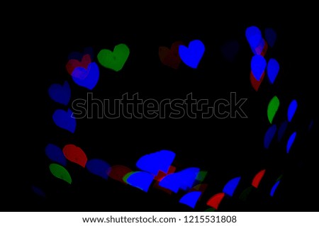 Red Green and Blue  lights bokeh.  Abstract background.  Heart-shaped bokeh.  Express love.  Valentine background.