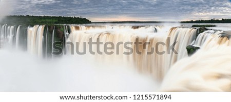 Iguazu falls waterfall from the Argentinian viewpoint using long exposure slow shutter photography