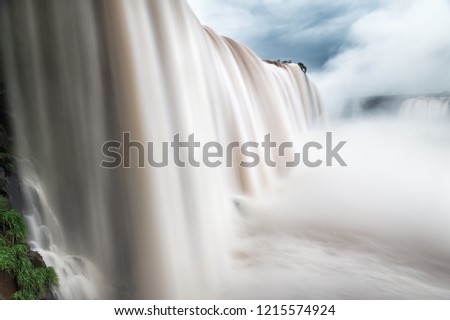 Close up for Iguazu Falls waterfall from Brazil side using long exposure slow shutter photography